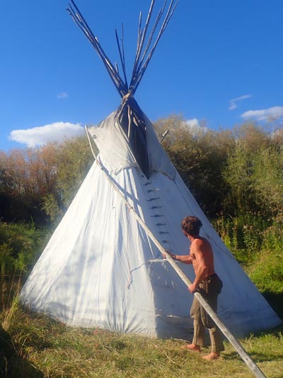 Adjusting tipi flaps.