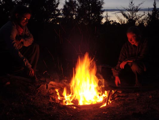 Tending the campfire.