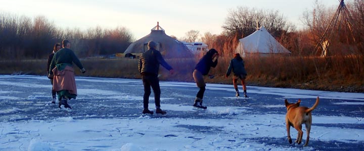 Ice skating on the pond at Green University's River Camp.